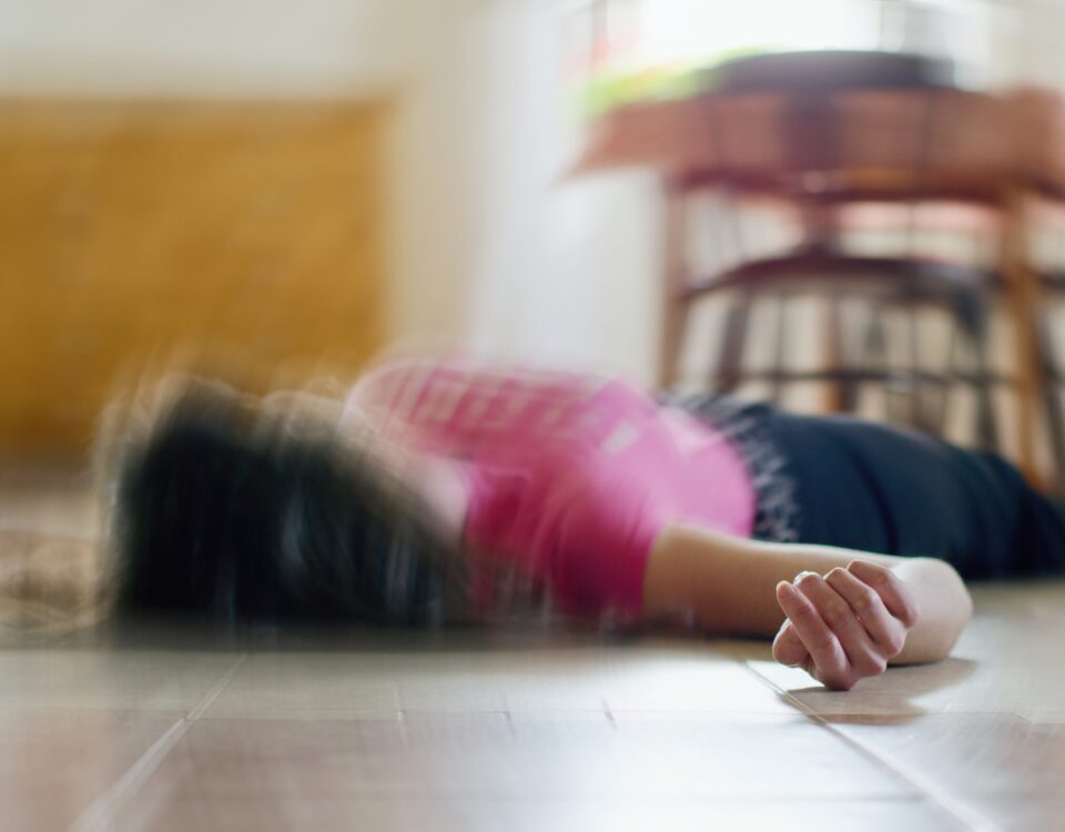 Woman lying on the floor out of focus image