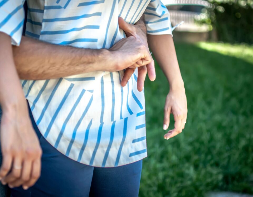 Giving the heimlich maneuver.