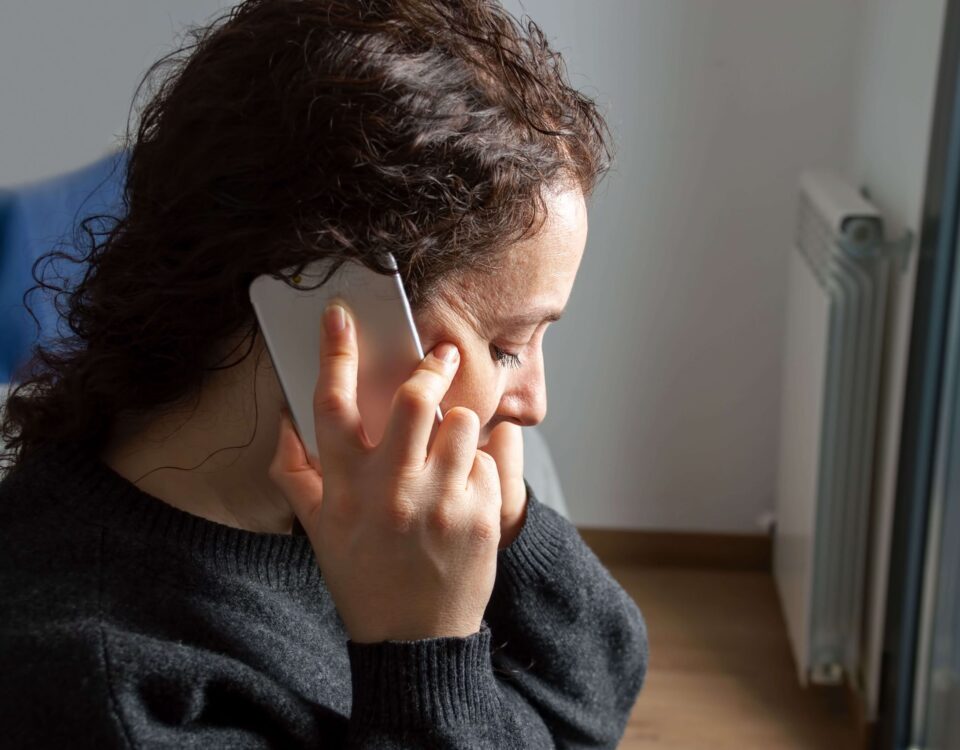 Sadness woman talking by smartphone
